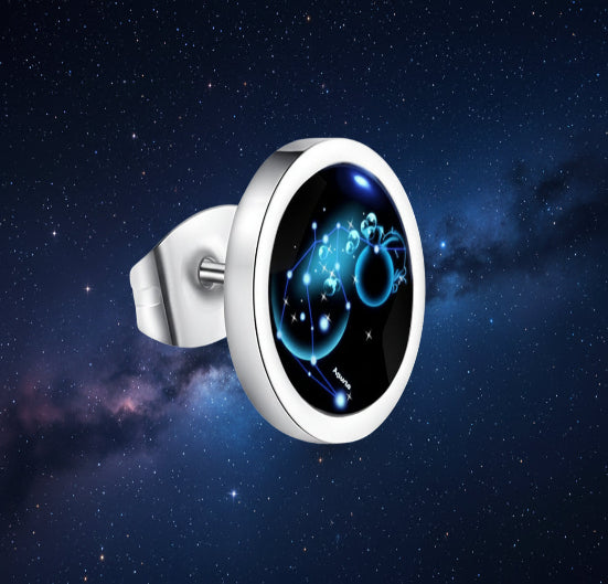 Silver ring with a blue and black gemstone on a white background from nested wisdom