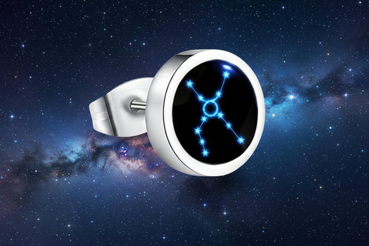 Silver ring with a blue and black gemstone on a white background from nested wisdom