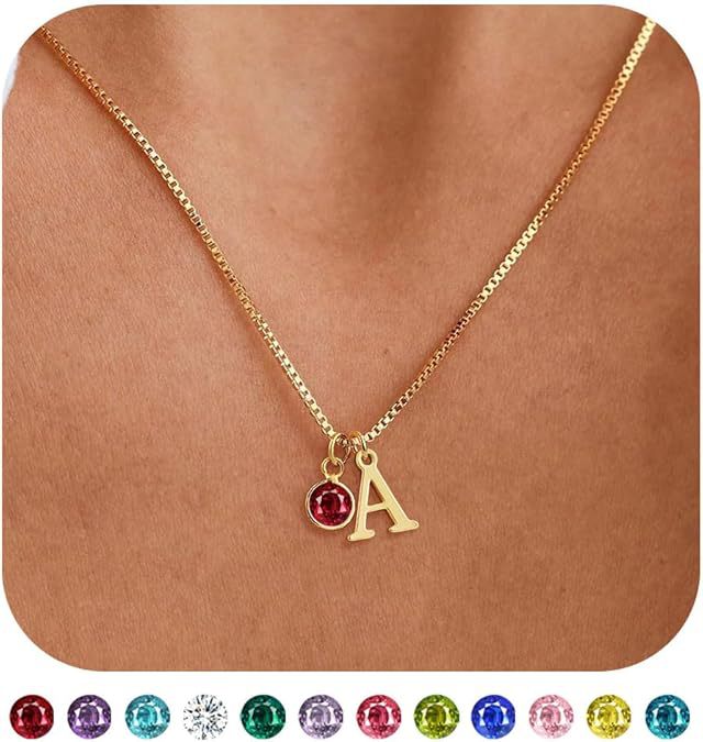 Gold necklace with a letter 'A' pendant on a brown background