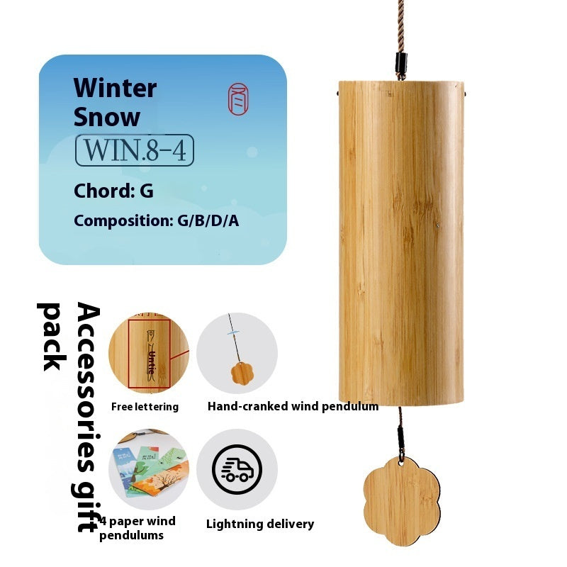 Wooden wind chime with label indicating 'Winter Snow' and product details on a white background