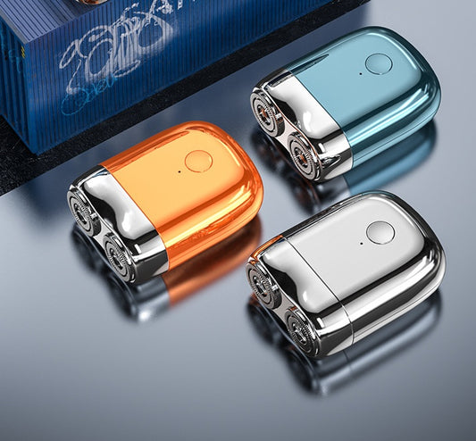 Three metallic devices in orange, blue, and silver on a reflective surface with a blurred background.