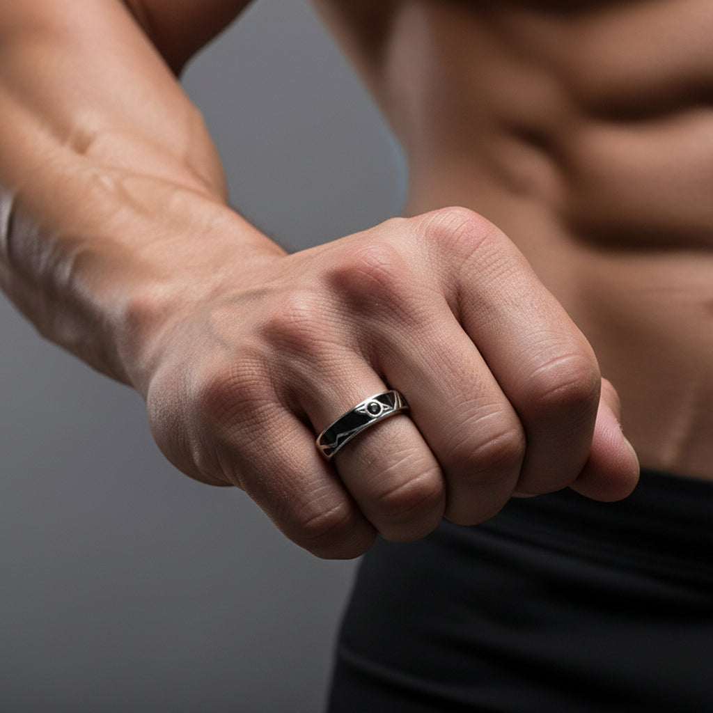 Silver ring with black design on a man