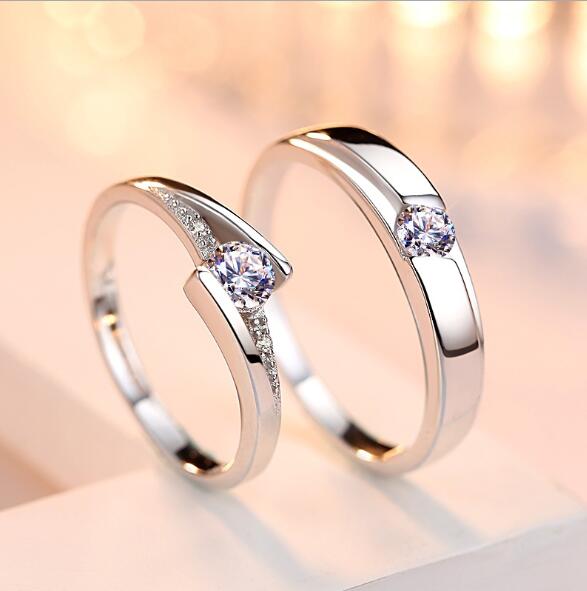 Two silver rings with gemstones on a soft, blurred background
