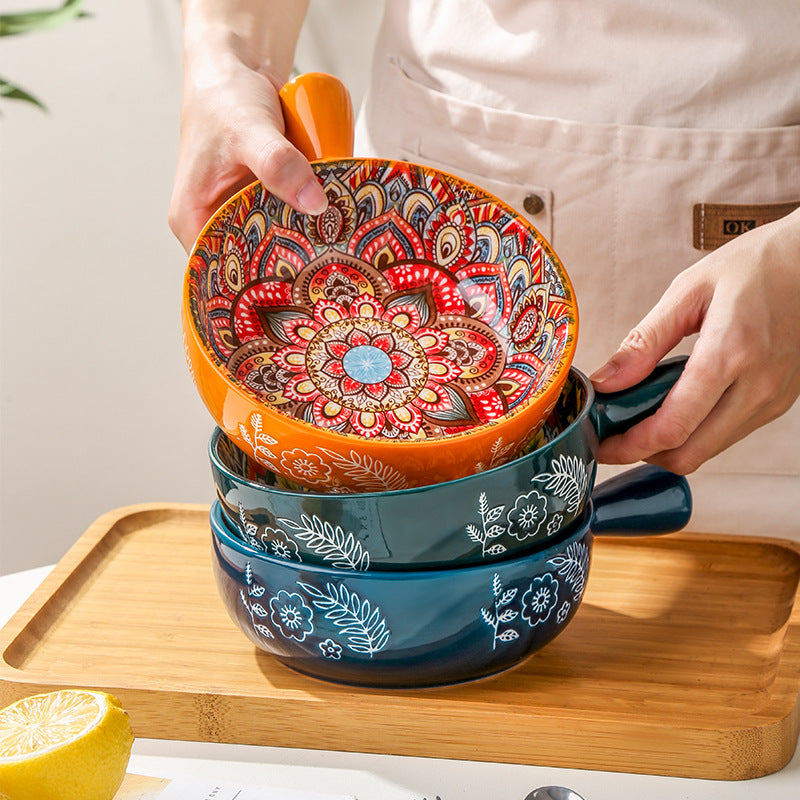 Stack of colorful ceramic bowls with intricate designs on a wooden tray. From Nested Wisdom