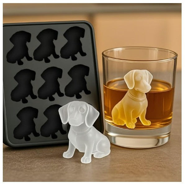 Dog-shaped ice cubes in a glass with a silicone mold in the background
