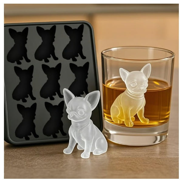 Silicone mold with dog shapes next to a glass of alcohol