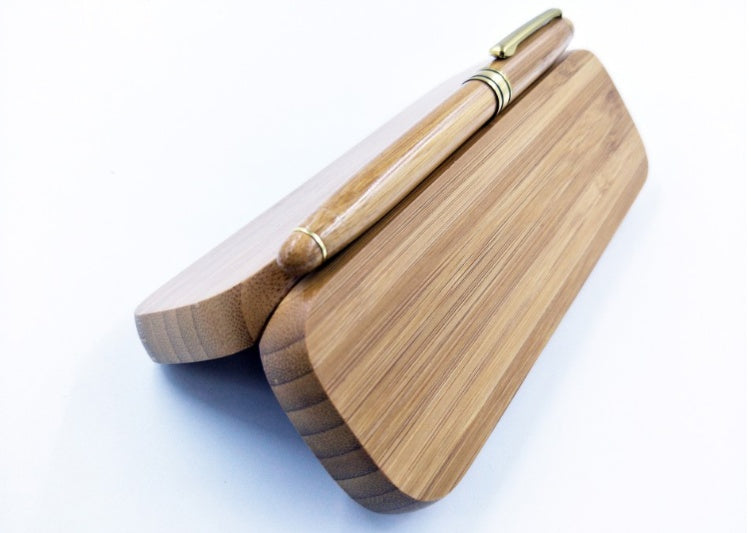 “Bamboo pen resting on open box showing fitted interior”