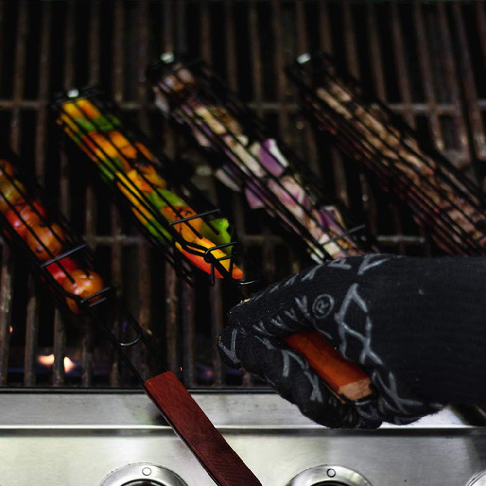 Person grilling with colorful skewers on a grill