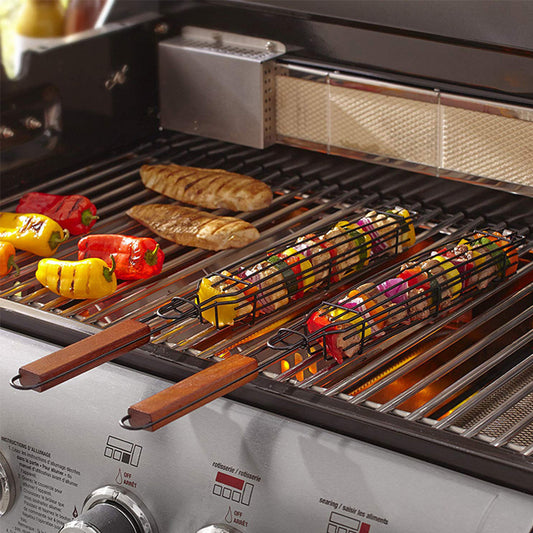 Grill with vegetables and meats cooking on a gas grill
