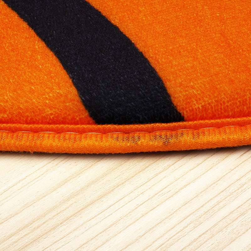 Close-up of Basketball-rug with a black stripe on a wooden floor.