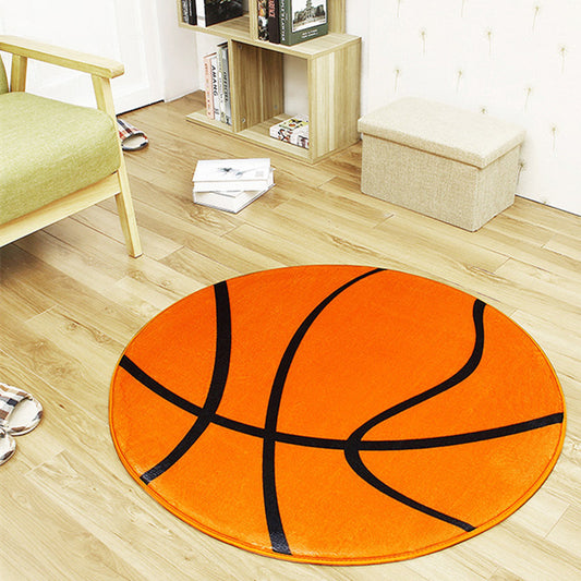 Basketball-shaped rug on a wooden floor in a room with furniture.