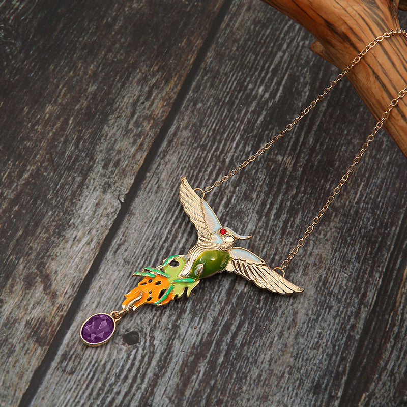 Necklace with a dragon pendant on a wooden surface