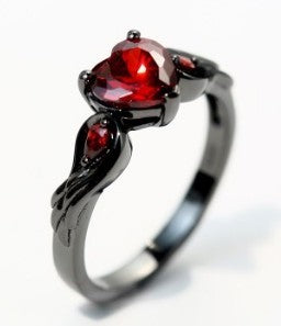 Ring with red gemstone on a white background