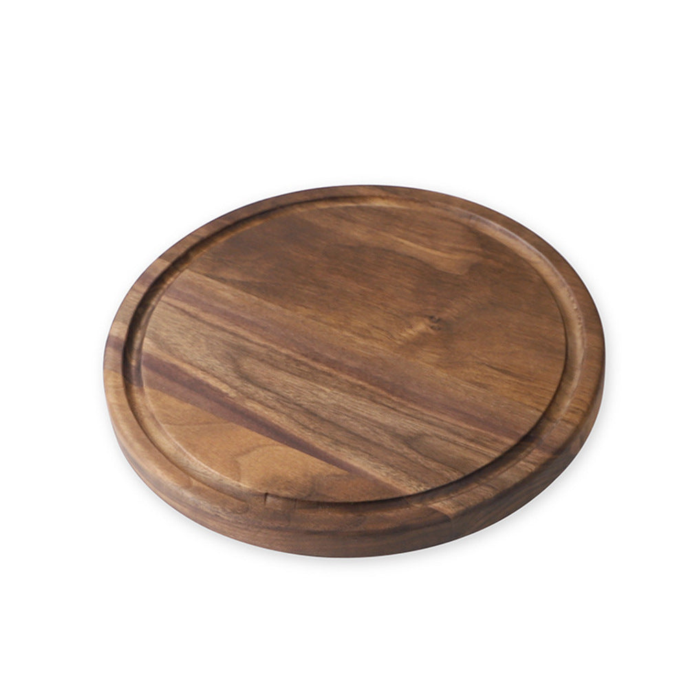 Wooden round cutting board on a white background