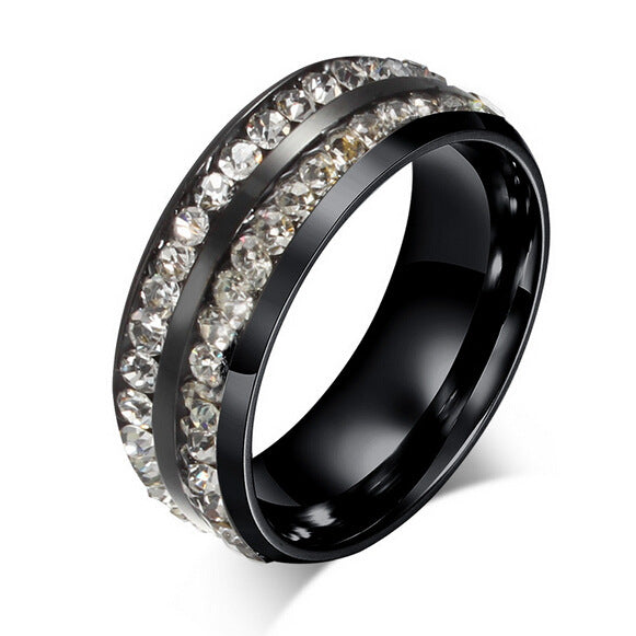 Black ring with diamond-studded band on a white background
