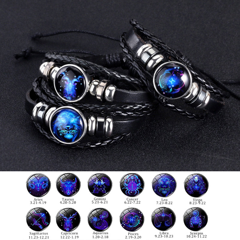 Black leather bracelets with horoscope sign charms on a dark background