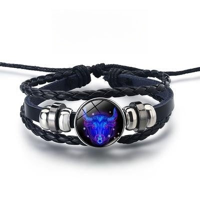 Bracelet with blue and purple lion head design on a white background