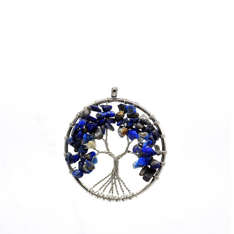 Tree-shaped pendant with blue stones on a white background