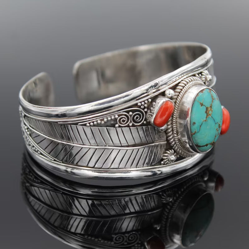 Bohemian Turquoise-Style Vintage Pattern Cuff Bracelet on black table