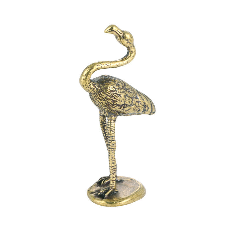 Bronze flamingo statue on a white background