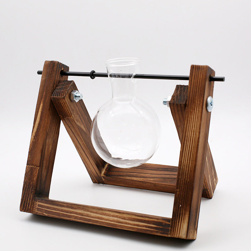 Wooden frame with a glass bulb inside on a white background
