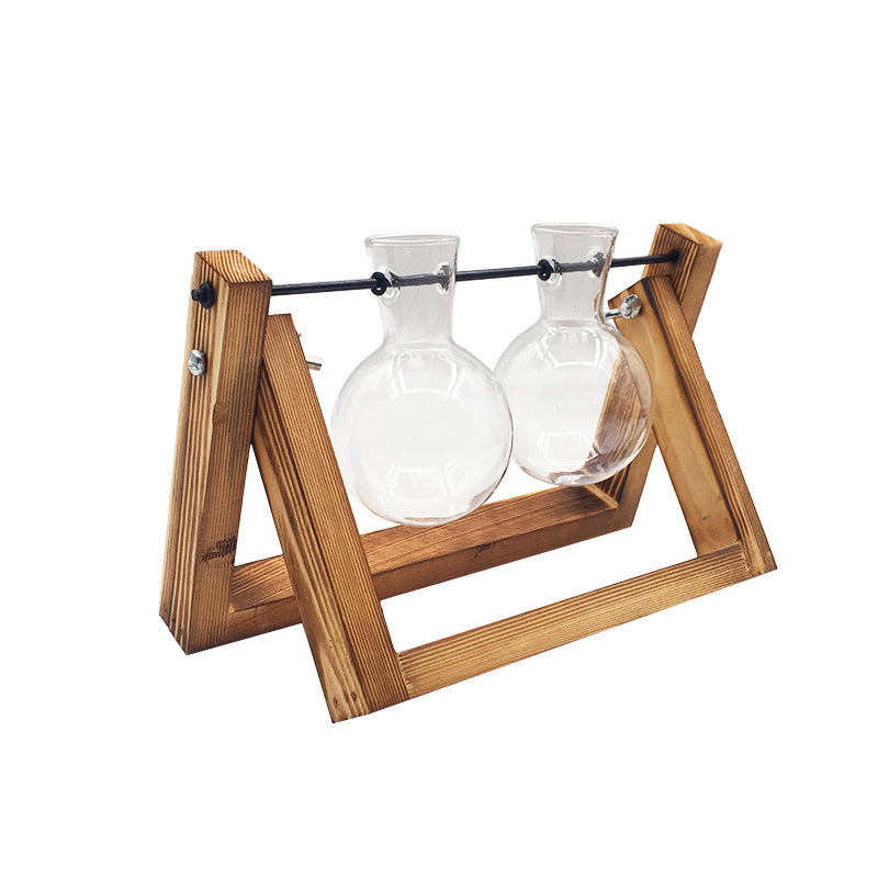 Wooden stand with two glass carafes on a white background