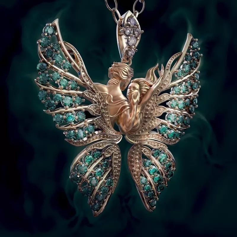 Ornate pendant with emerald stones on a dark background