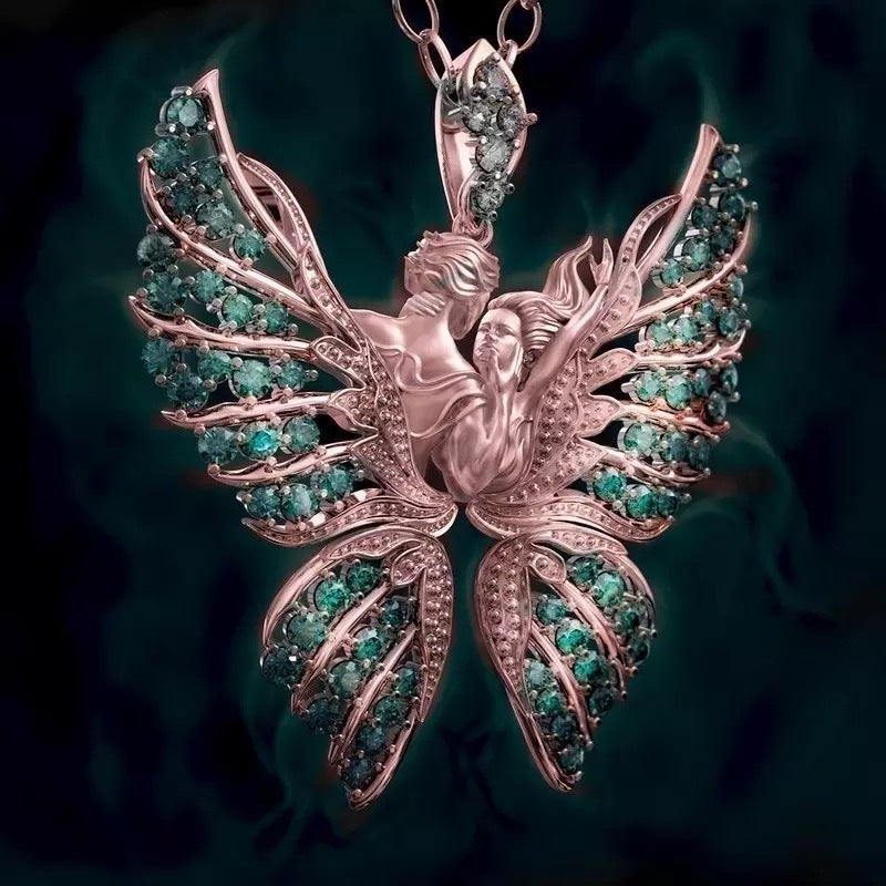 Rose gold and emerald pendant on a dark background