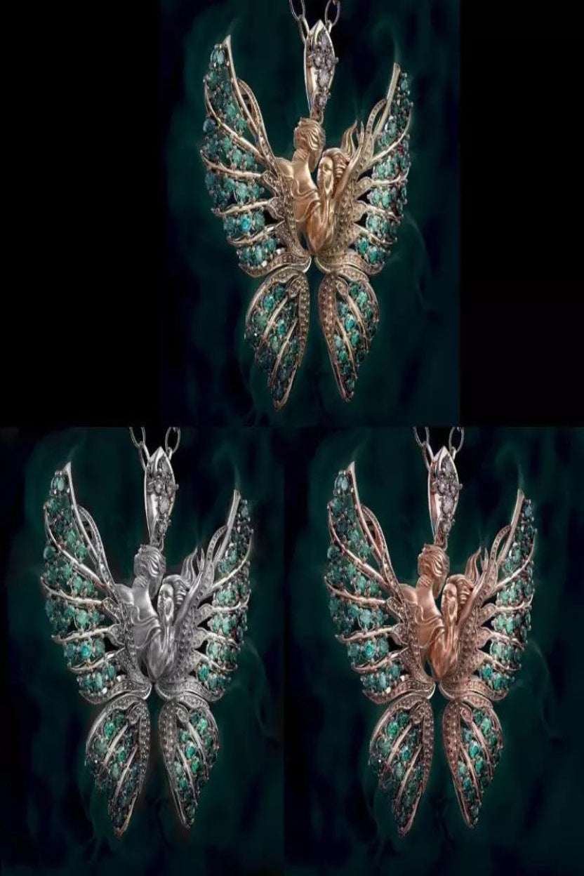 Three butterfly-shaped pendants in gold, silver, and rose gold with gemstone accents on a dark background.