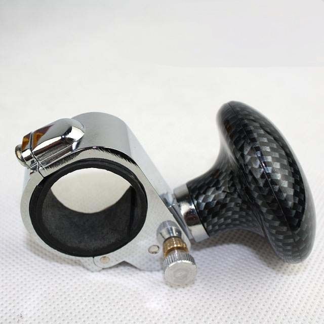 “Black textured steering wheel spinner knob with quick-tightening clamp”