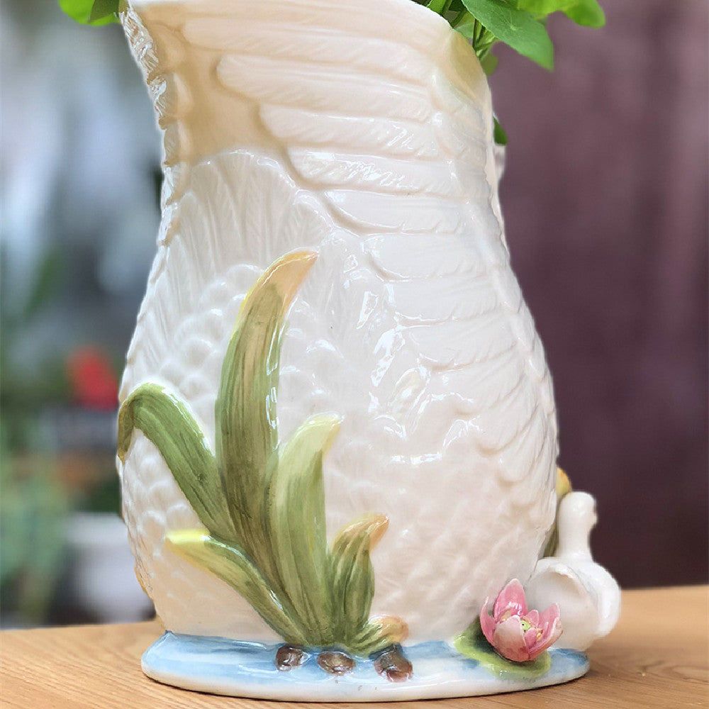 Decorative ceramic vase with floral design on a wooden surface