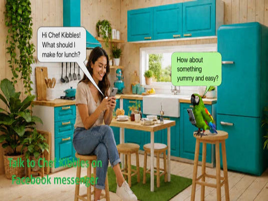 Woman in a kitchen with a parrot, using a smartphone, surrounded by teal cabinets and decor.