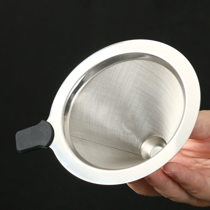 Stainless steel mesh strainer held by a hand against a black background