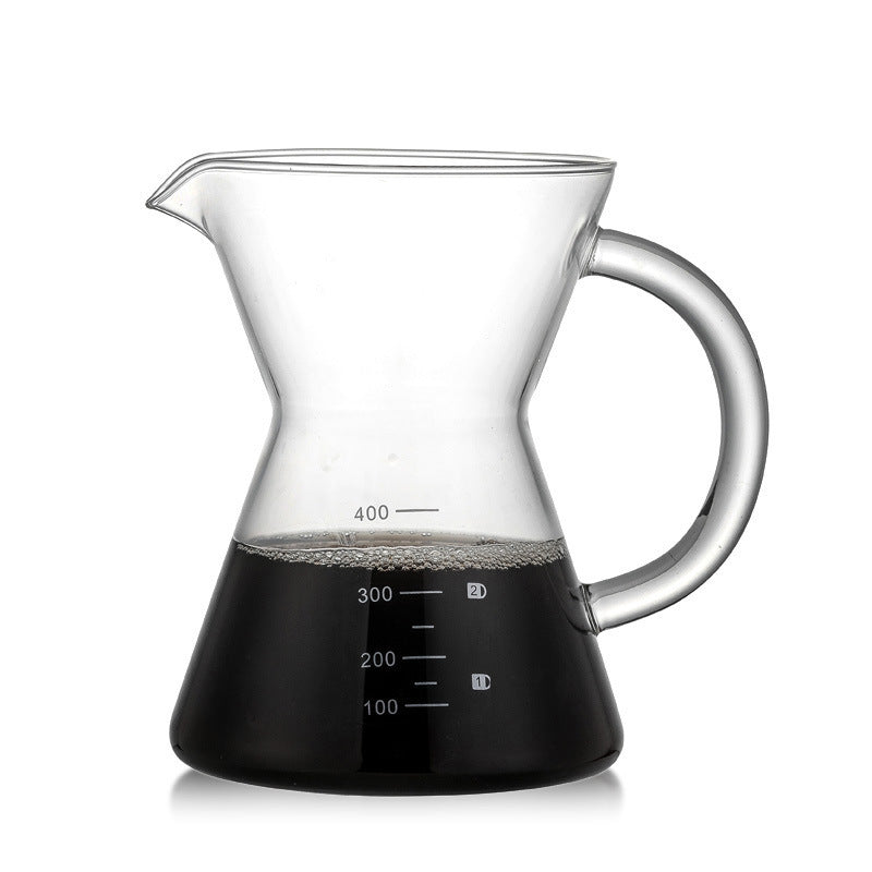 Clear glass pitcher with black base and handle on a white background
