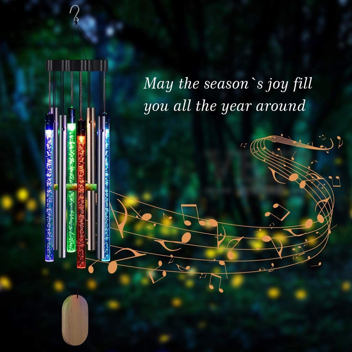 Decorative wind chime with musical notes and text on a dark background