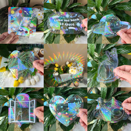 Collage of various colorful holographic stickers held against a leafy green background.