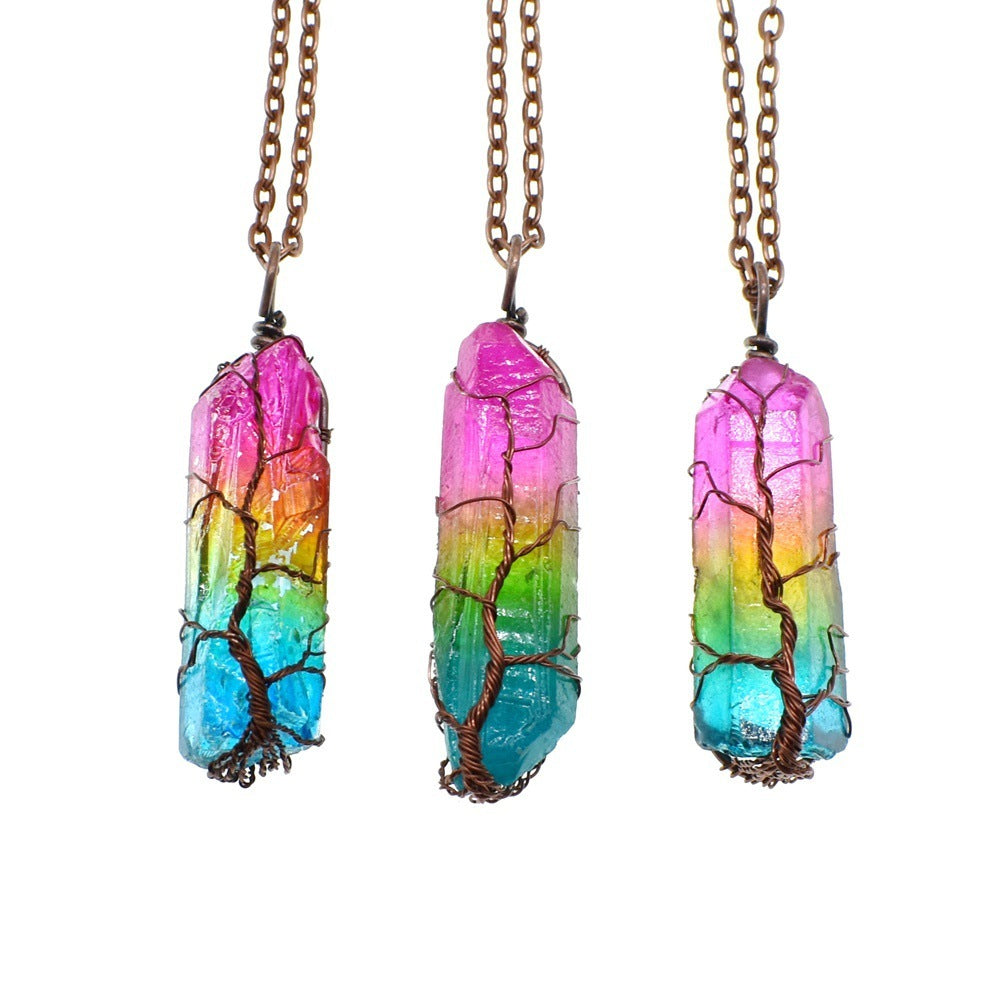 Three colorful crystal necklaces with tree designs on a white background