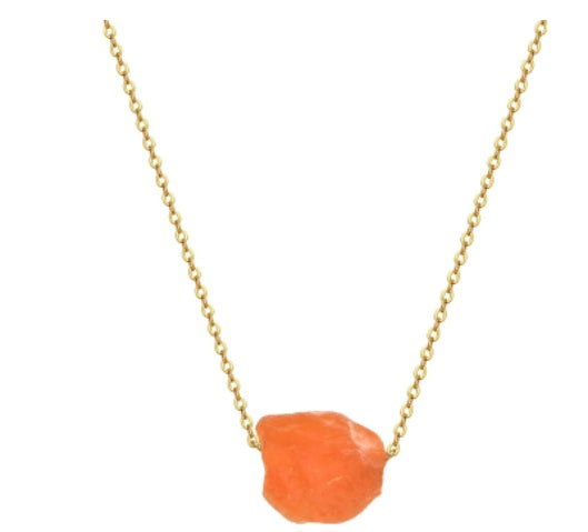 Necklace with a gold chain and orange stone pendant on a white background