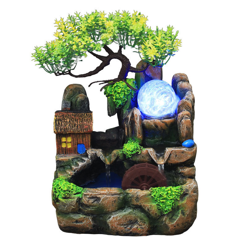 Decorative fountain with trees, rocks, and a glowing orb on a white background