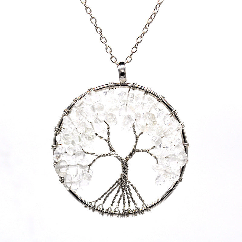 Tree of Life pendant necklace with clear stones on a white background
