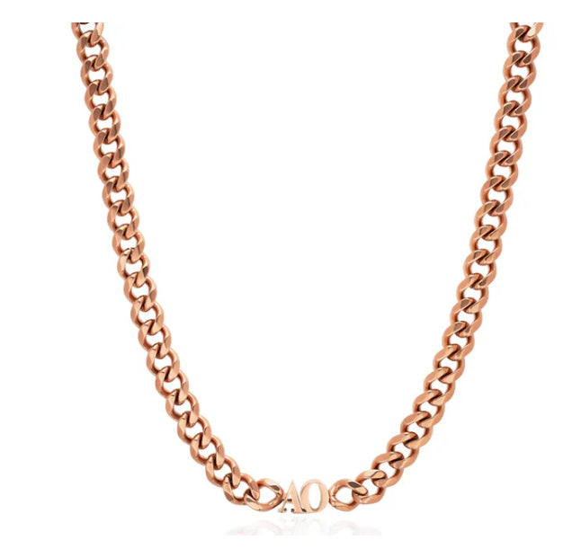 Rose gold chain necklace on a white background
