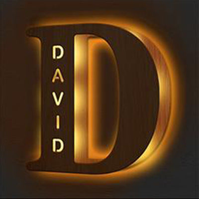 Gold letter 'D' with 'DAVID' inside on a dark background