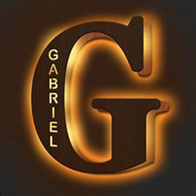 Decorative letter 'G' with 'Gabriel' text on a dark background