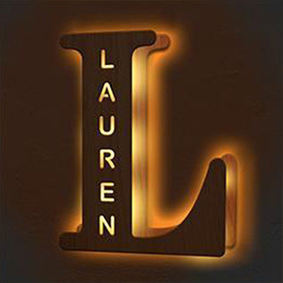 Neon sign with the name 'Lauren' in a stylized letter 'L'.