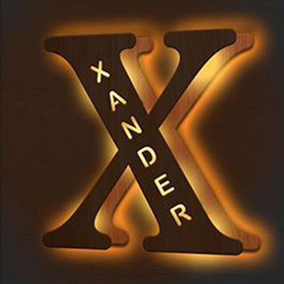 Neon sign with the letter 'X' and the name 'Xander' on a dark background