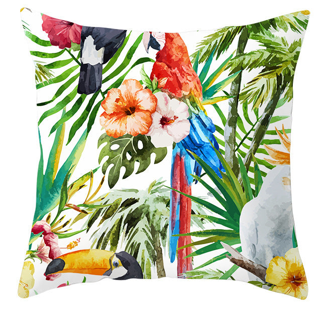 Decorative pillow with tropical birds and plants design on a white background