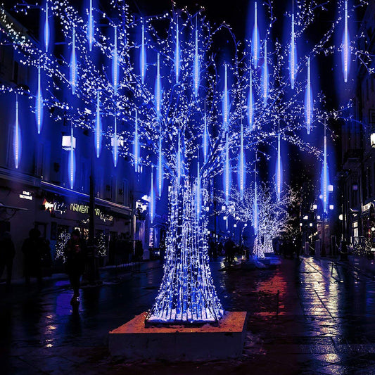 Decorative blue light trees in an urban setting at night
