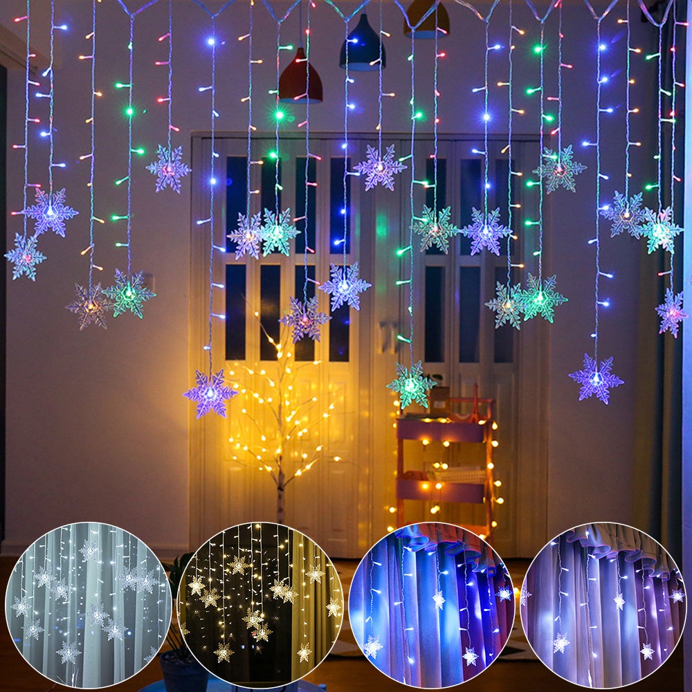 Decorative string lights with snowflake designs hanging in a room.