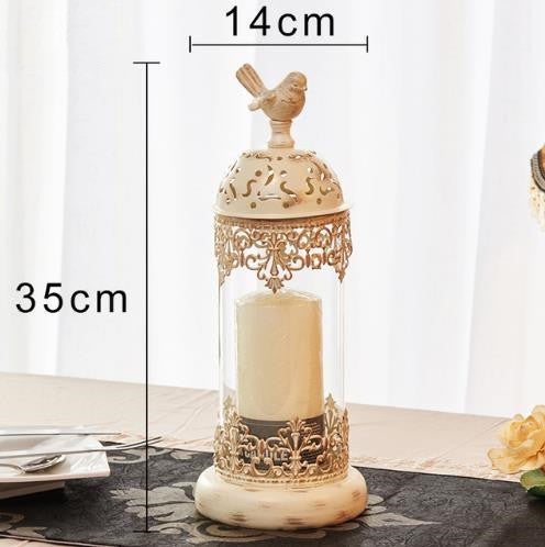 Decorative candle holder with bird design and measurements on a white background