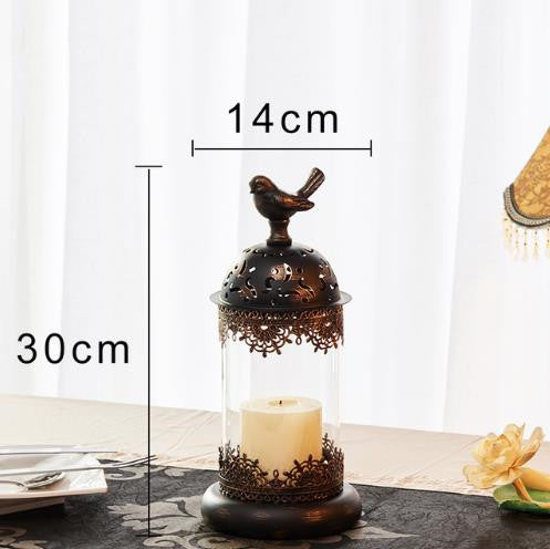 Decorative candle holder with bird design and measurements on a white background